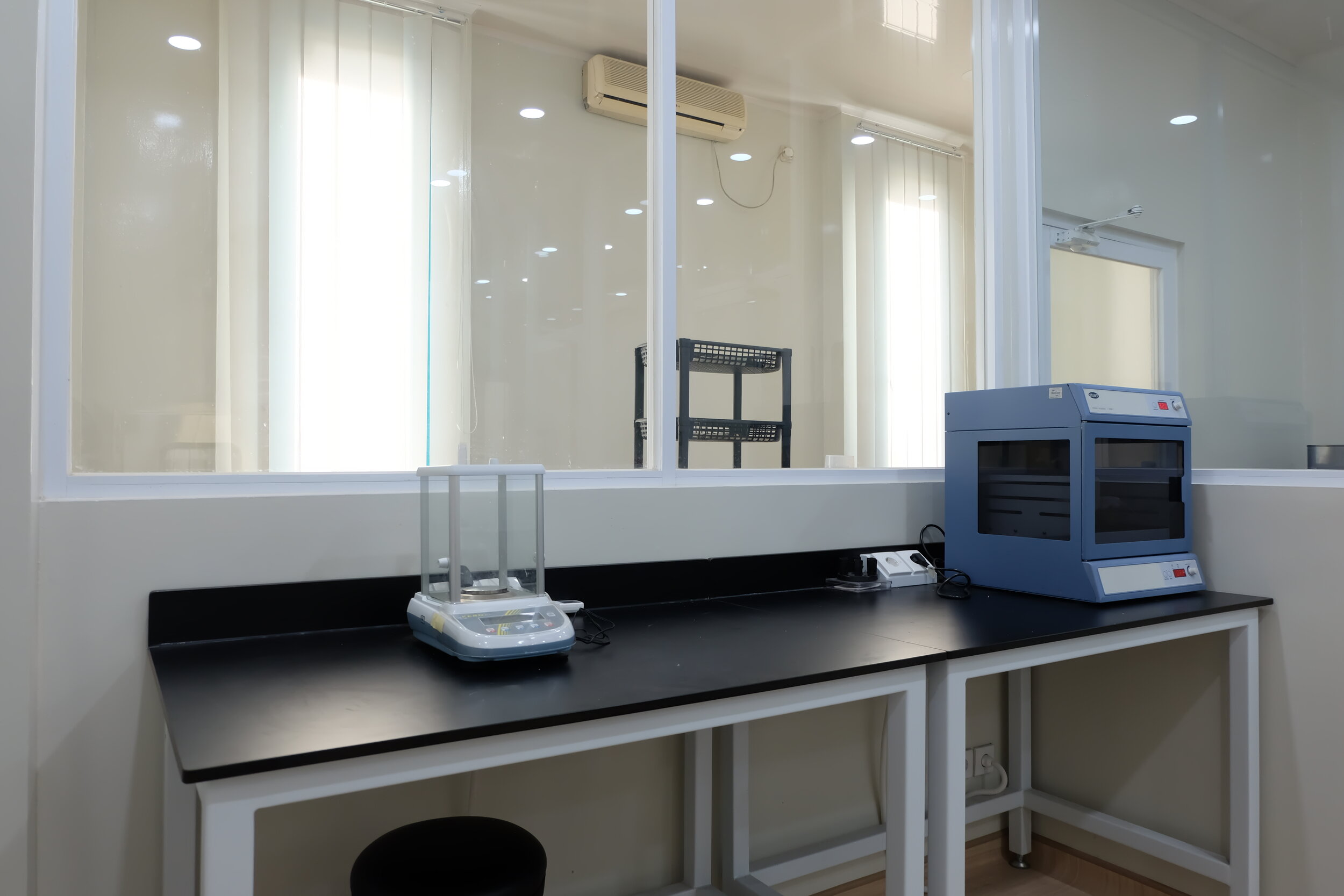 A balance and an incubator in Cultiva's laboratory in Bandung.