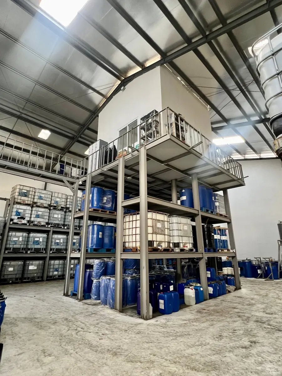 Racked drums and IBC totes inside the Cultiva manufacturing centre at Ketapang, Bandung.